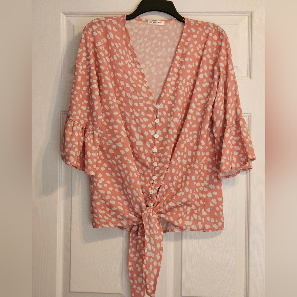 Beautiful light pink blouse with large white polka dots. Adorable classy look!